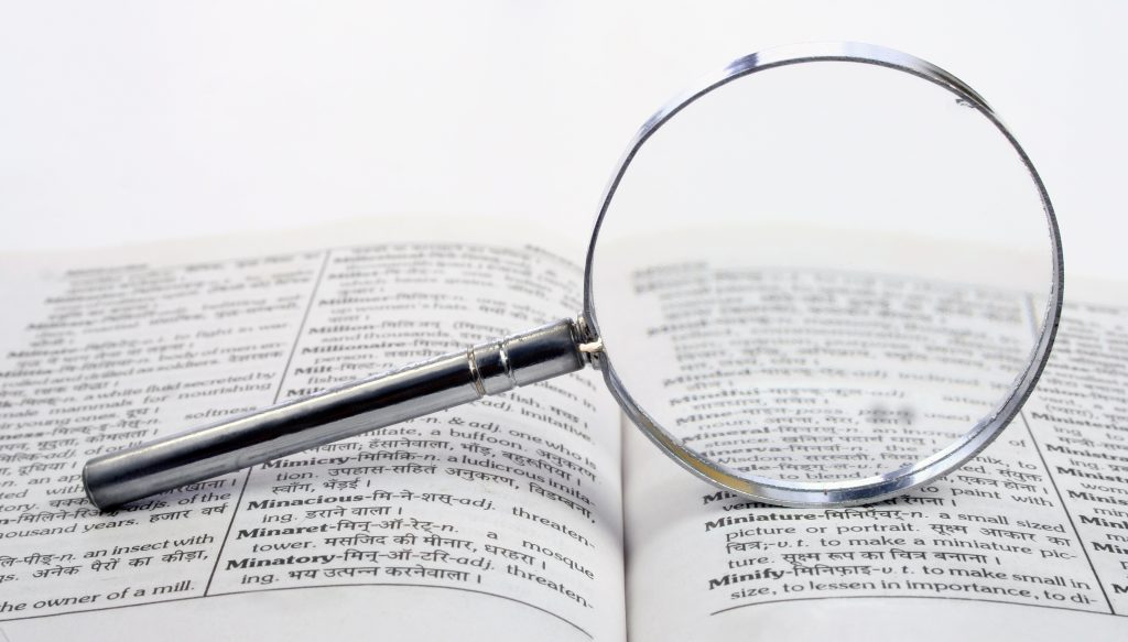 Magnifying Glass and Dictionary