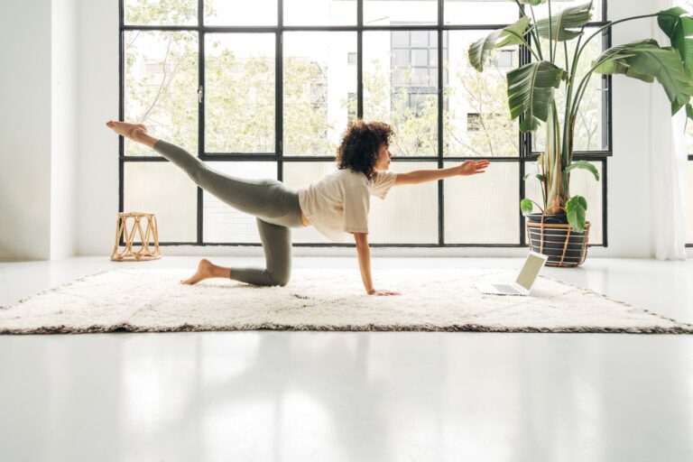 woman practicing yoga, wellness