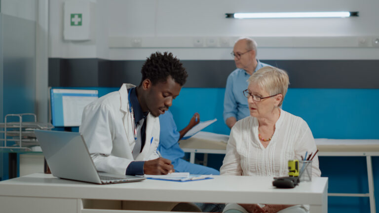 doctor discussing plan with patient at table